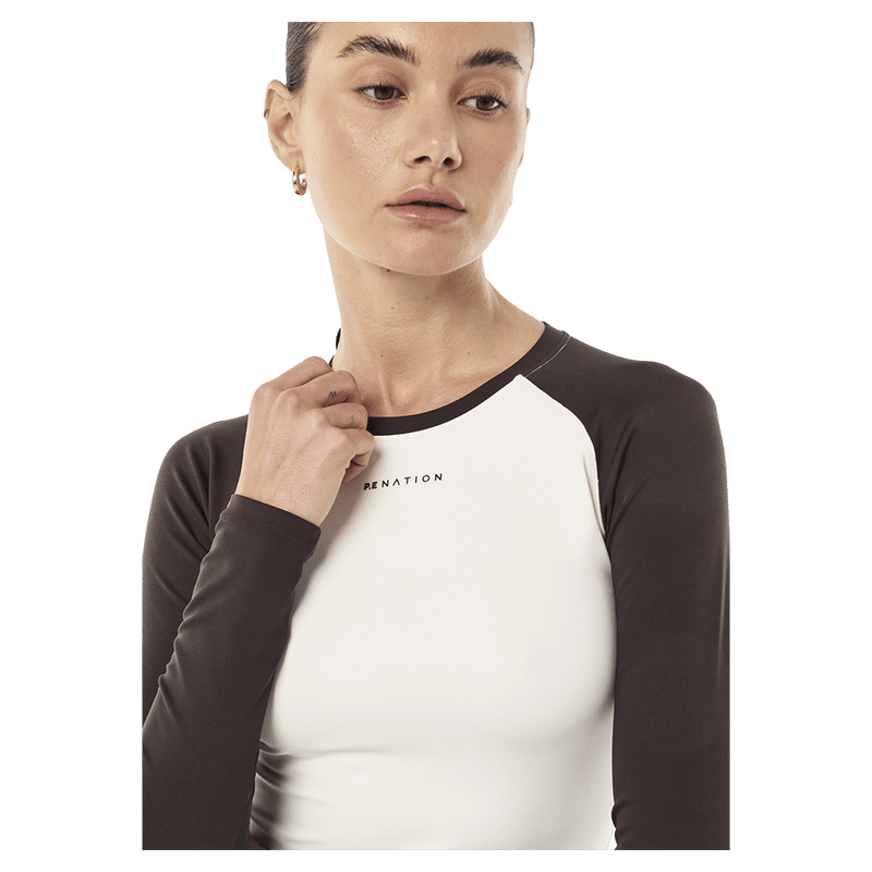 Close view of P.E Nation Signature LS Top - Womens in colour Coffee/Whisper White.