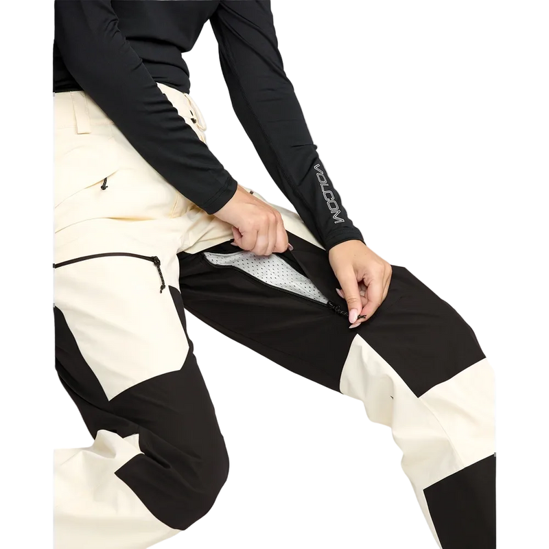 Image of the The Volcom Stone Mica 20K Snowboard Pants – Womens in Bone colourway. Features contrast black knee, inner cuff and upper backside patches; zip and button fastening, belt loops, hip and thigh zip pockets, and inner thigh vents with zip closure.
