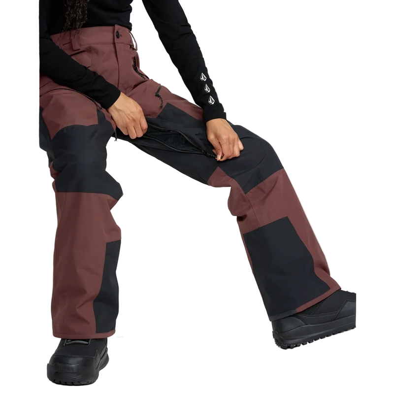 Image of the The Volcom Stone Mica 20K Snowboard Pants – Womens in Oxblood colourway. Features contrast black knee, inner cuff and upper backside patches; zip and button fastening, belt loops, hip and thigh zip pockets, and inner thigh vents with zip closure.