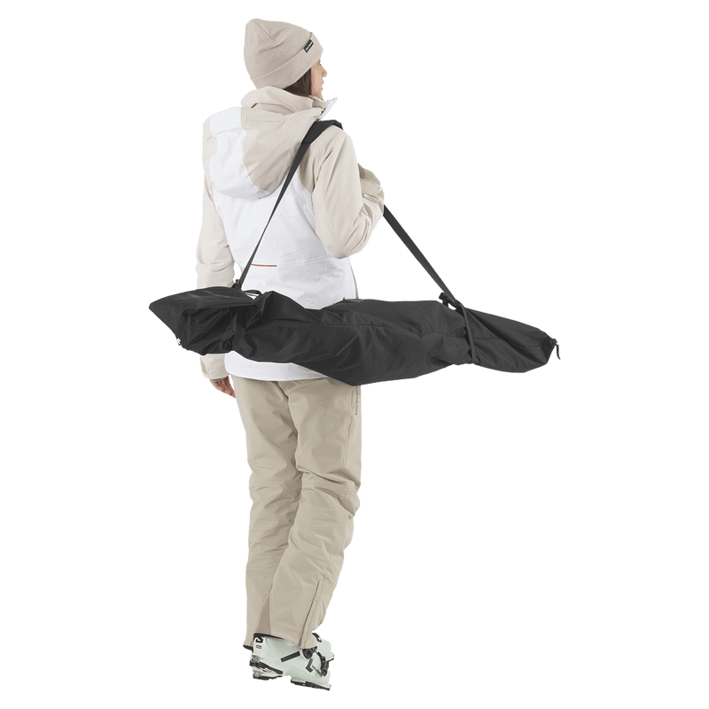 Carried view of the Salomon Original 1 Pair Ski Bag in Black colourway, unisex model