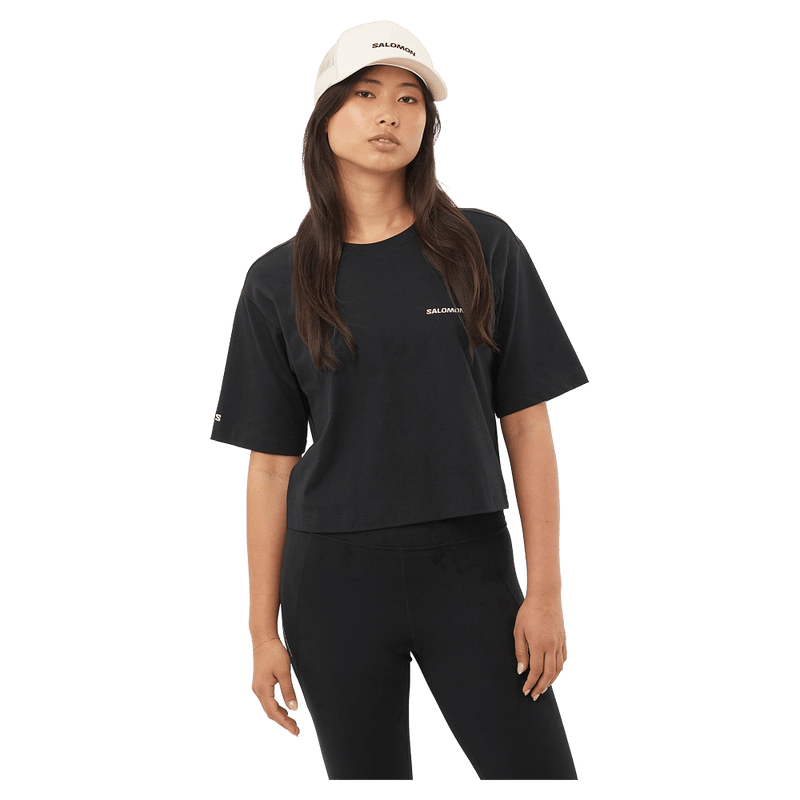 Front view of the Salomon Short Tee in Deep Black colourway, women model