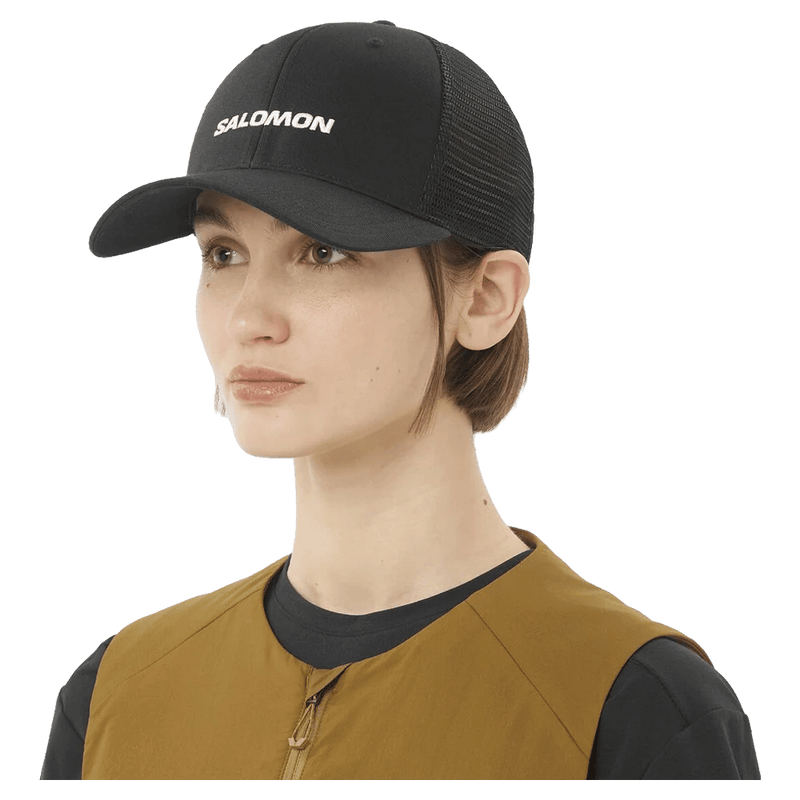 Worn view of the Salomon Trucker Cap in Deep Black colourway, unisex model