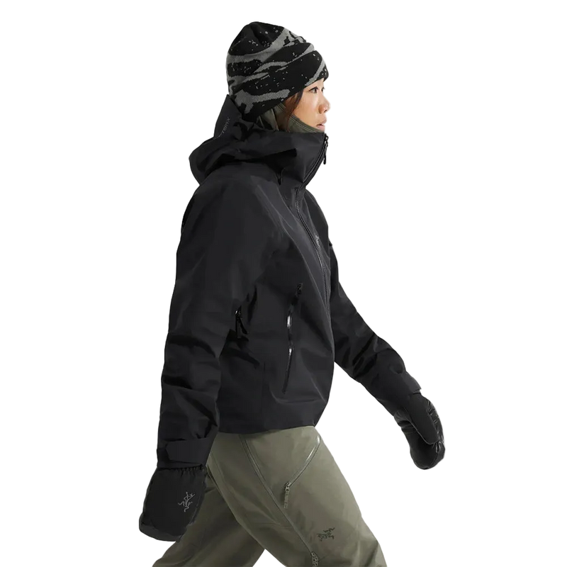 Side view of a woman wearing the Sentinel Ski Jacket in Black.