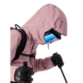 Detail view of a woman wearing the Sentinel Ski Jacket in Bliss Black featuring a helment compatible Storm Hood. 