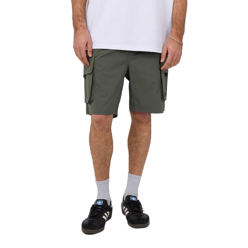 Front view of Man wearing Silent Theory's Cleaver Cargo Shorts in forest colourway
