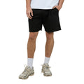 Front view of Man wearing Silent Theory's Essential Theory Shorts in black colourway