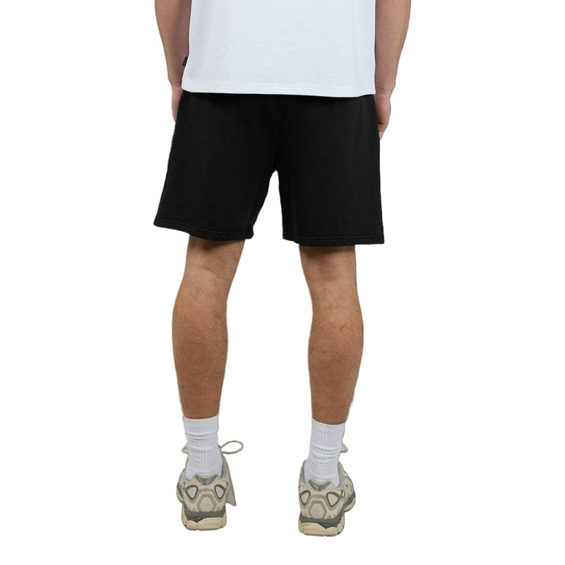 Back view of Man wearing Silent Theory's Essential Theory Shorts in black colourway