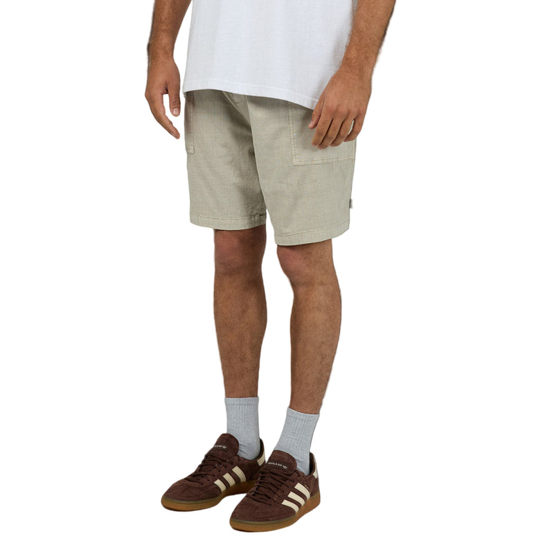 Man wearing Silent Theory Patch Pocket Shorts in brown colourway