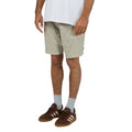Man wearing Silent Theory Patch Pocket Shorts in brown colourway