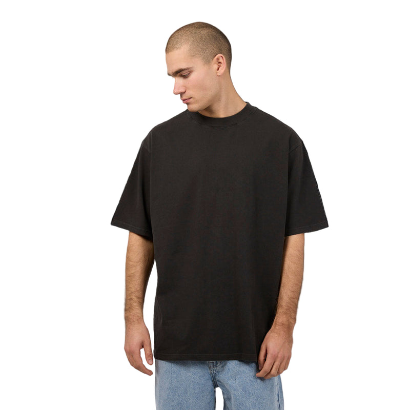 Man wearing Silent Theory Heavy Weight Tee in washed black