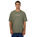 Front view of Men wearing Silent Theory's Stayin Ahead Tee in olive colourway