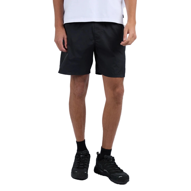 Man wearing Silent Theory Tres Shorts in black colourway