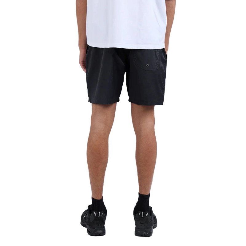 Back view of man wearing Silent Theory Tres Shorts in black colourway