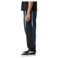 Side view of Afends Sporting Recycled Paneled Track Pants in colour Navy.
