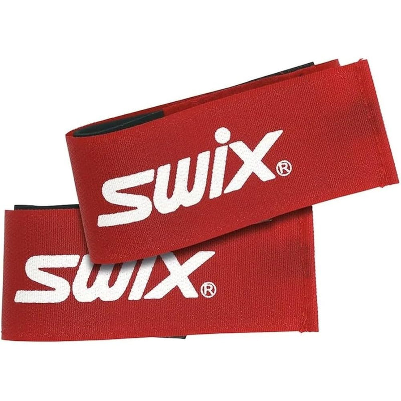 Red plastic wrap around ski straps with velcro closure and white Swix name