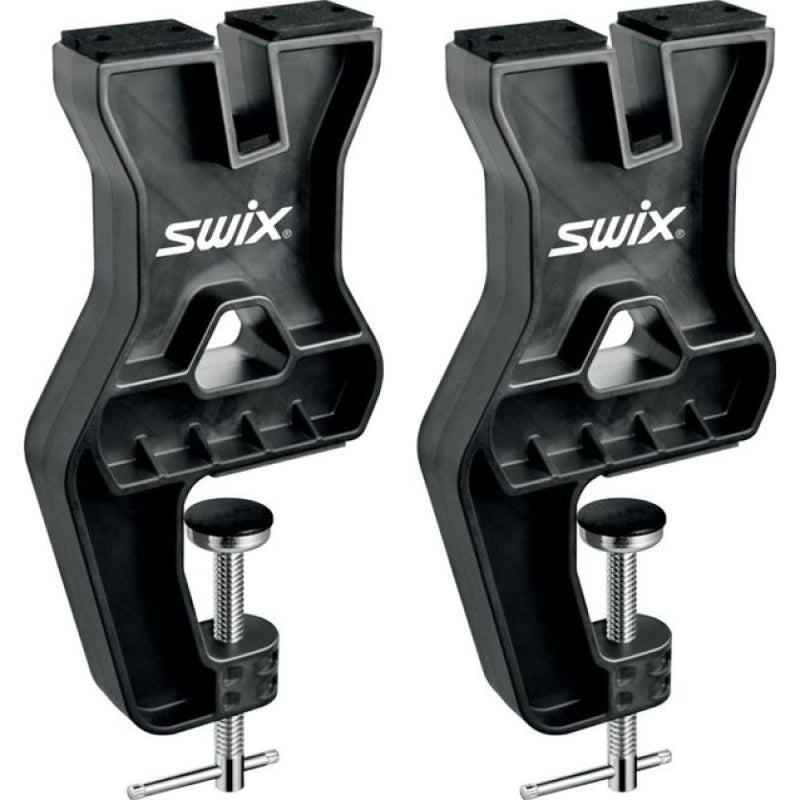 A pair of Swix Tuning vise in black ballistic plastic with silver metal screws vises