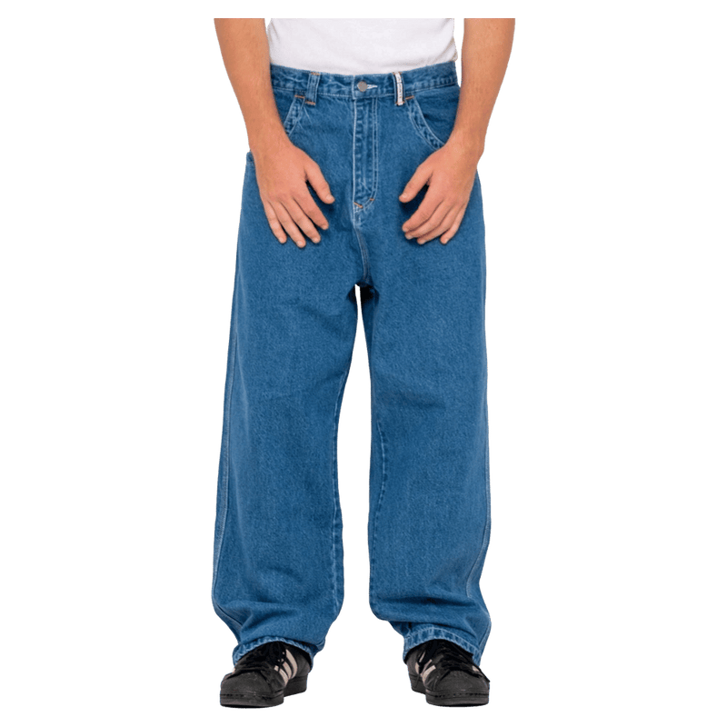 View of man in Rusty Turbo Baggy Jean in colour Middy Blue