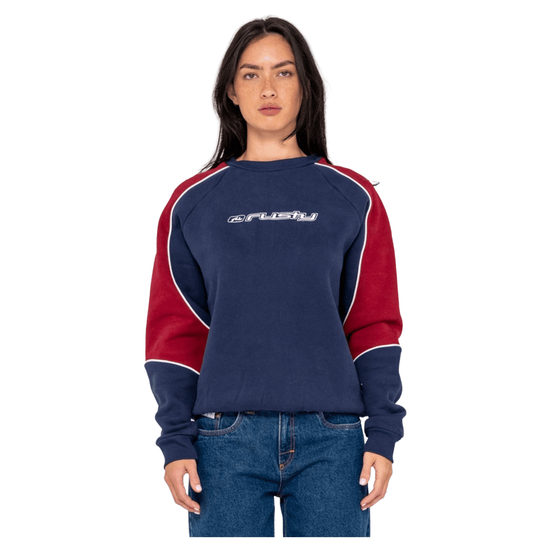 View of women in Rusty South Of The River Oversize Crew Fleece in colour Navy/Red