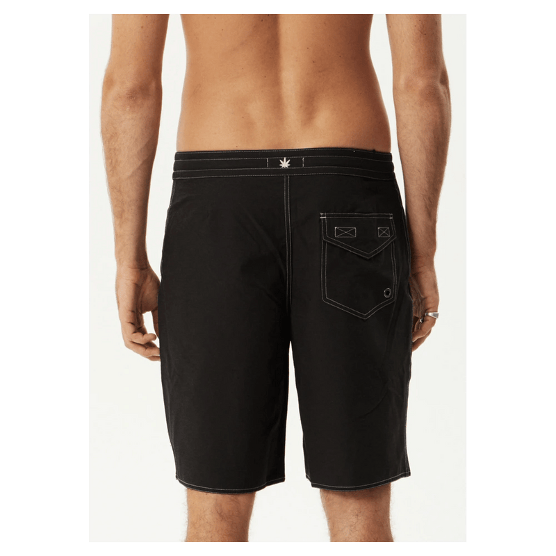 Back view of black Afends fixed waist boardshorts with white contrast stitching and a single rear flap pocket.