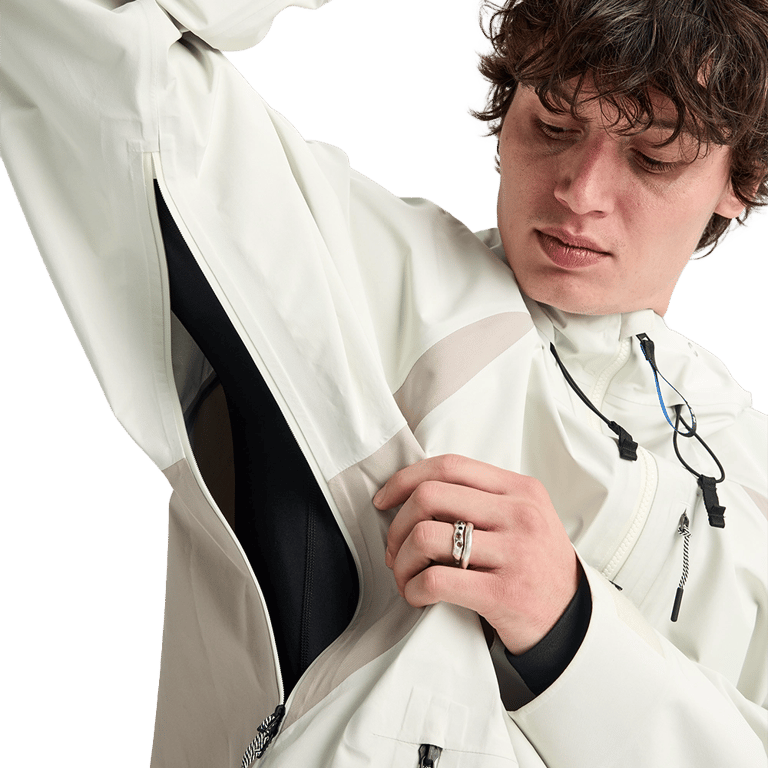 Analog Hardpack 3L Snowboard Jacket in off-white showing the open underarm ventilation zipper and technical fabric.