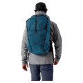 Blue Arcteryx Aerios 35 backpack with grid pattern and bungee cords, worn by a person from the back.