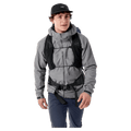 Front view of a man wearing a black Arcteryx Aerios 35 Backpack with a vest-style harness and adjustable chest straps.