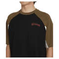 Front close view of man wearing the Billabong Immortal System OG Tee in black