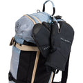 Black Burton AK Clutch Gore-Tex Mitts with leather palms clipped to a blue grid-patterned backpack.