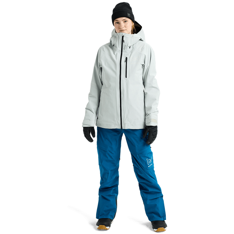 Burton AK Upshift Gore-Tex 2L Womens Snowboard Jacket in light grey with hood and black zippers, front view on model.