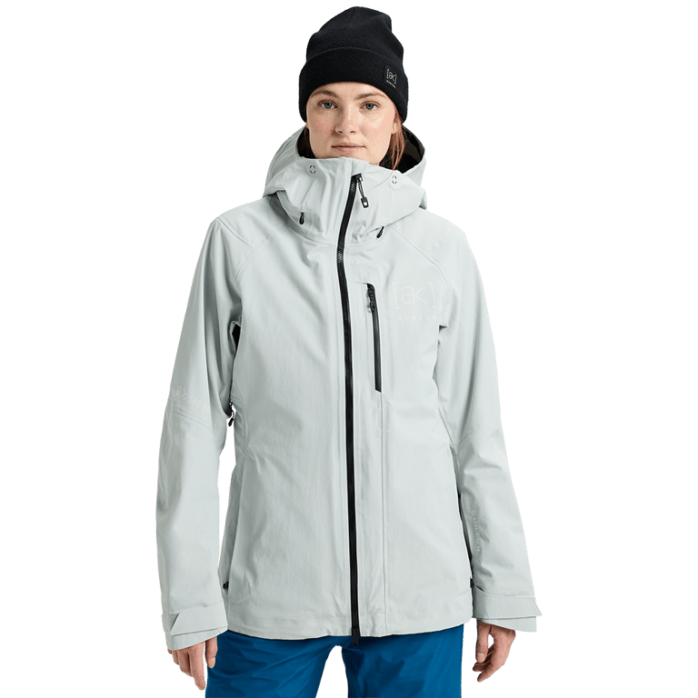 Light grey Burton AK Upshift Gore-Tex 2L Women's Snowboard Jacket with black zippers and a hood.