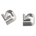 Two silver aluminum Burton logo stomp pads on a black background.