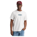 White Burton Dejaview short sleeve tee with a teal box logo on the chest, worn by a man in a maroon cap.
