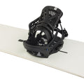 Black Burton Escapade EST women's snowboard binding with cutout highback and straps, mounted on a white board.