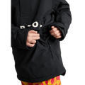 Black Burton Frostner Anorak kids' snowboard jacket showing a zippered side pocket and white logo on the chest flap.