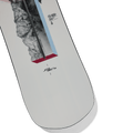 Close-up of white Burton Hideaway women's snowboard with mountain graphics and blue and red geometric accents.