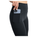 Black Burton MP Active Leggings for women featuring a high waist and a side pocket with a smartphone.