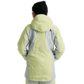 Back view of a light yellow and grey color-blocked women's hooded snowboard jacket with a small logo on the shoulder.