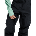 Black Burton Reserve Gore-Tex bib snowboard pants featuring a zippered inner thigh vent and white logo on the leg.