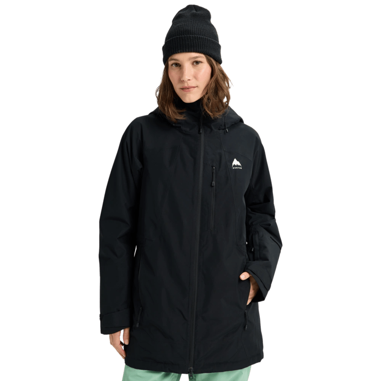 Woman wearing a black Burton Reserve Insulated Snowboard Jacket with a hood, chest pocket, and white mountain logo.