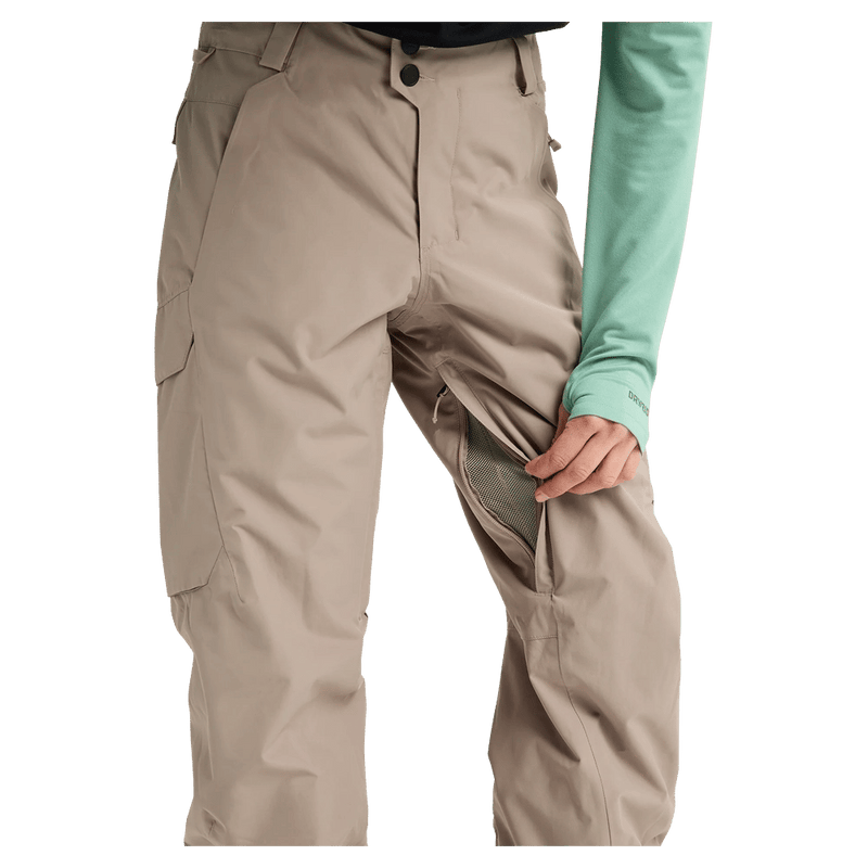 Tan Burton Reserve women's snowboard pants featuring a mesh-lined inner thigh vent and side cargo pocket.