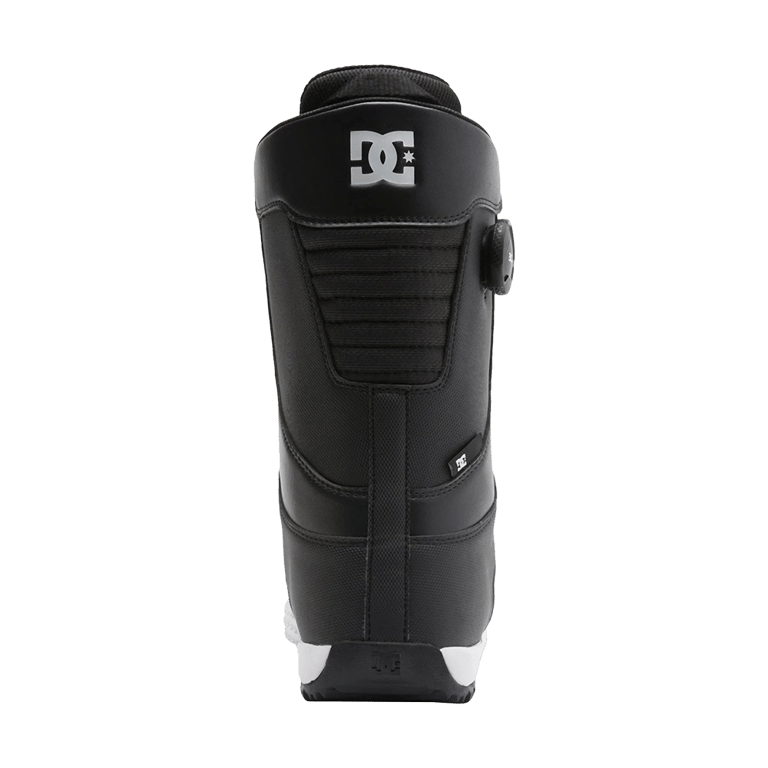 Rear view of black DC Control BOA snowboard boot with white logo, ribbed heel, and side BOA dial.