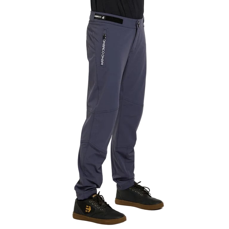 Dharco Gravity Kids mountain bike pants in charcoal grey with a zippered pocket and tapered leg, side view.