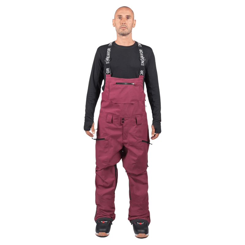 Maroon Endeavor 3L Shelter Bib Snowboard Pants with black branded suspenders and zippered pockets, front view.