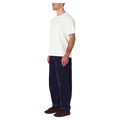 Side view of man in the Rollas Ezy Classic Tee in Colour Vintage White