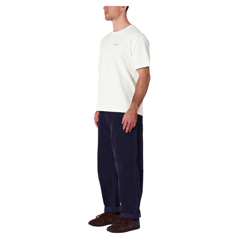 Side view of man in the Rollas Ezy Classic Tee in Colour Vintage White