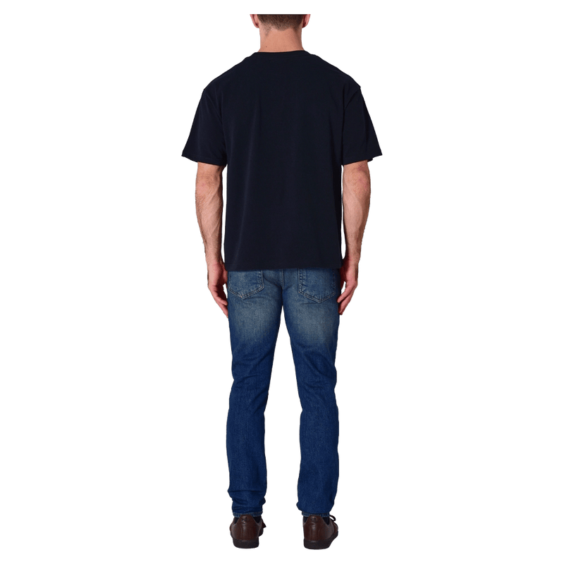 Back view of man in the Rollas Ezy Classic Tee in Colour Washed Black