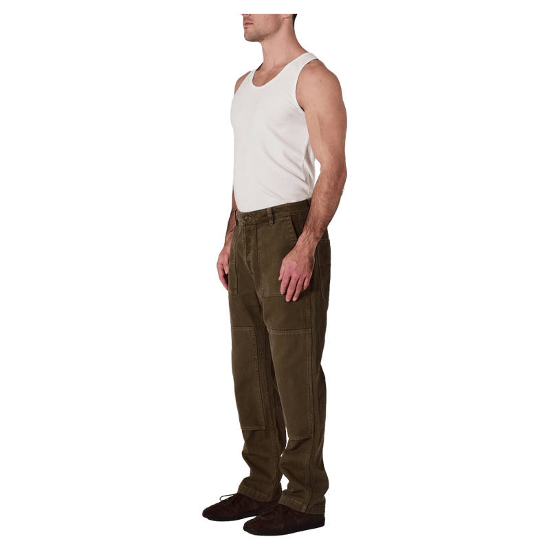 Side view of man in the Rollas Ezy Electric Jeans in colour Olive