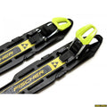 Black Fischer Xcelerator Classic kids cross-country ski bindings with bright yellow manual levers and logos.