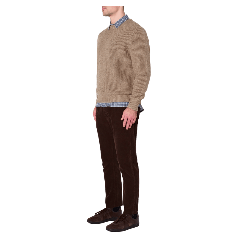 Side view of man in the Rollas Fishermans Tweed Crew in colour Linseed
