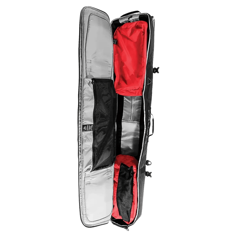 Open Jones Expedition Snowboard Bag showing silver interior lining, red storage bags, and black mesh pocket.